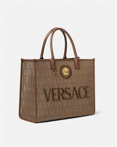 women's versace clutch bag|Versace handbags with big zipper.